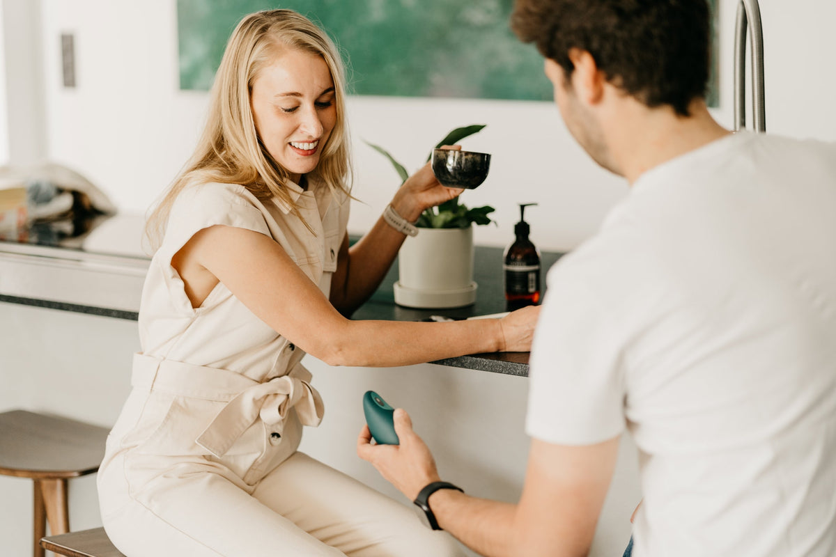 Man hands over a moonbird to a woman.