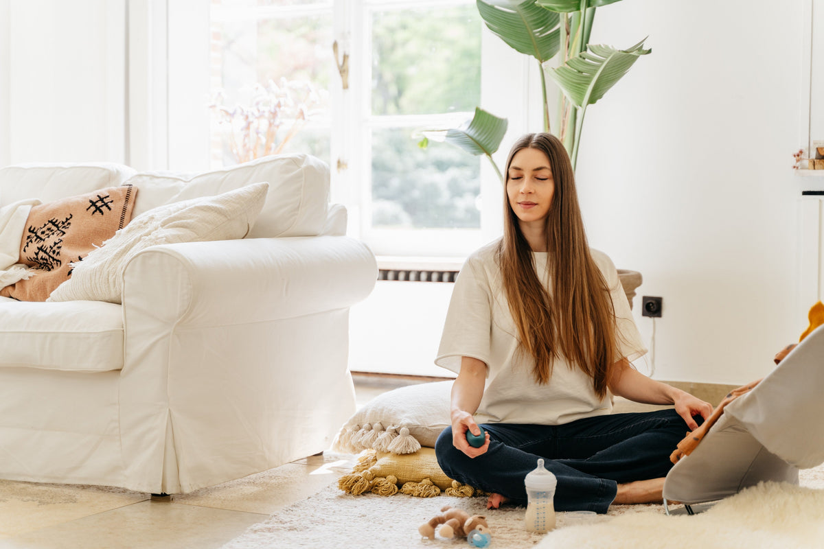 woman doing breathwork exercises in living room