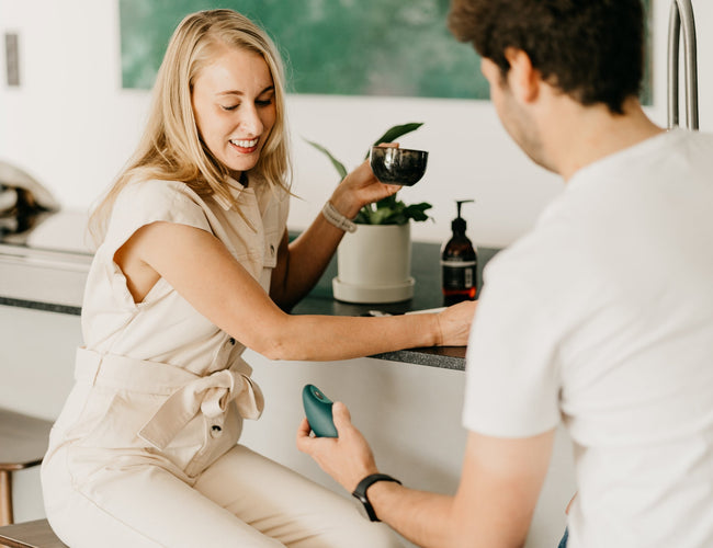 Man hands over a moonbird to a woman.