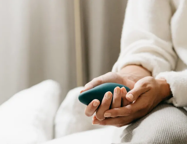 woman holding breathwork device