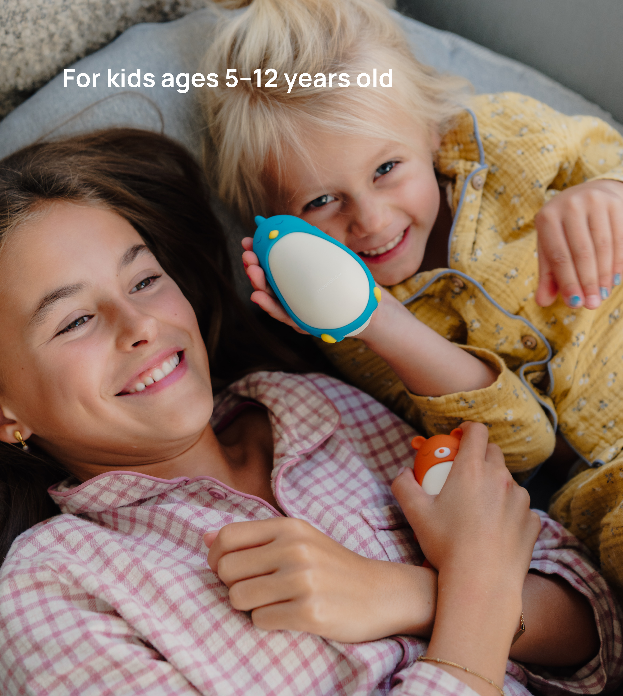 Kids of different ages holding moonbuddy [en]